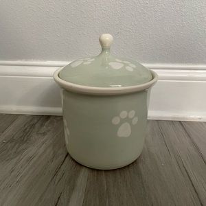 Ceramic lidded dog treat Jar. Sea foam green with white paws.